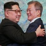 Moon Jae and Kim Jong-un hug